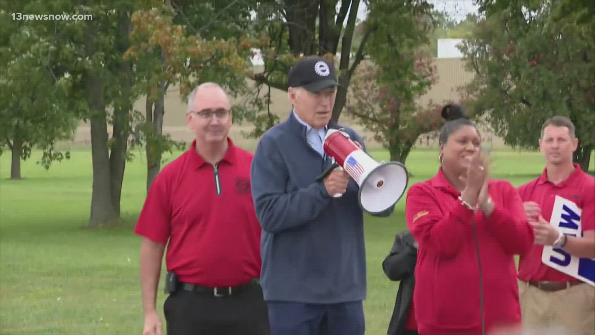 President Joe Biden grabbed a bullhorn on the picket line and urged striking auto workers to “stick with it” in an unparalleled show of support for organized labor.