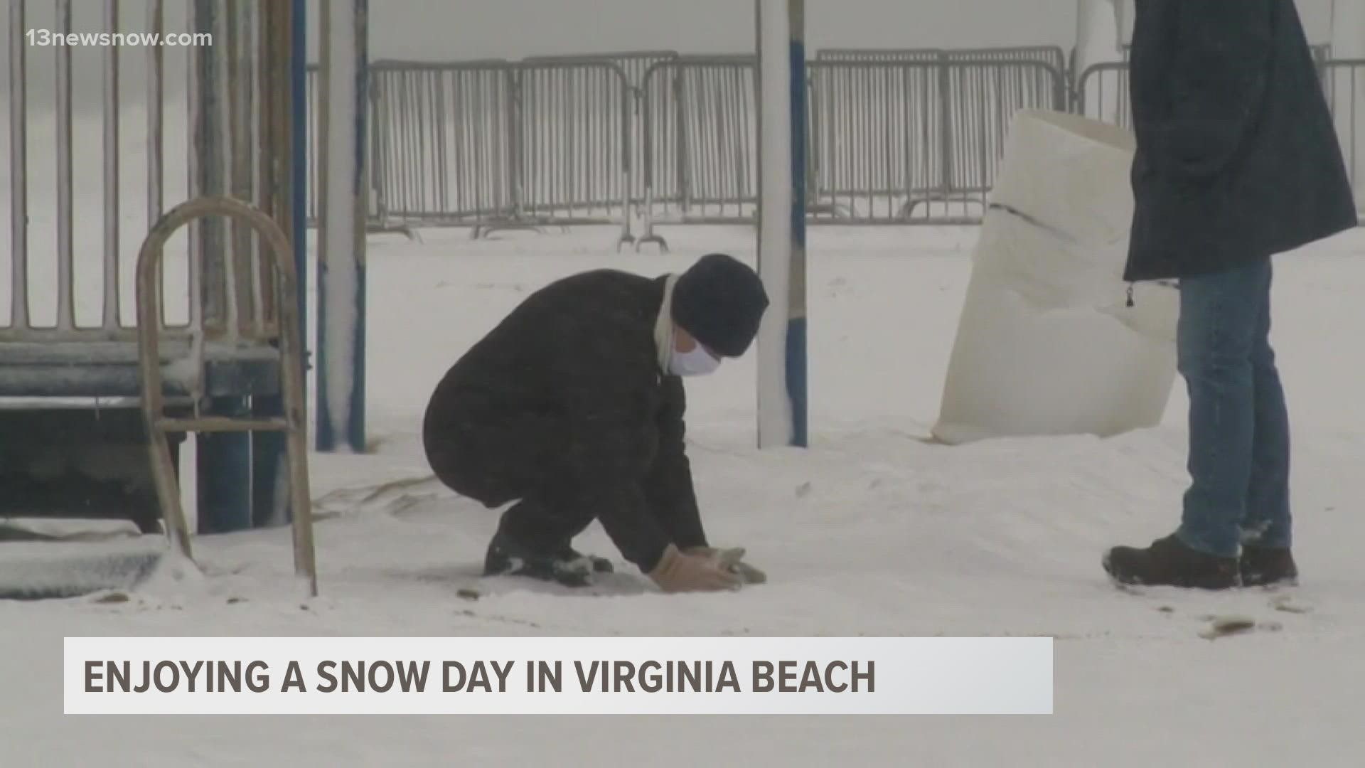 Virginia Beach saw strong winds as the snow fell, but it didn't stop a few people from making a trip to the Oceanfront.