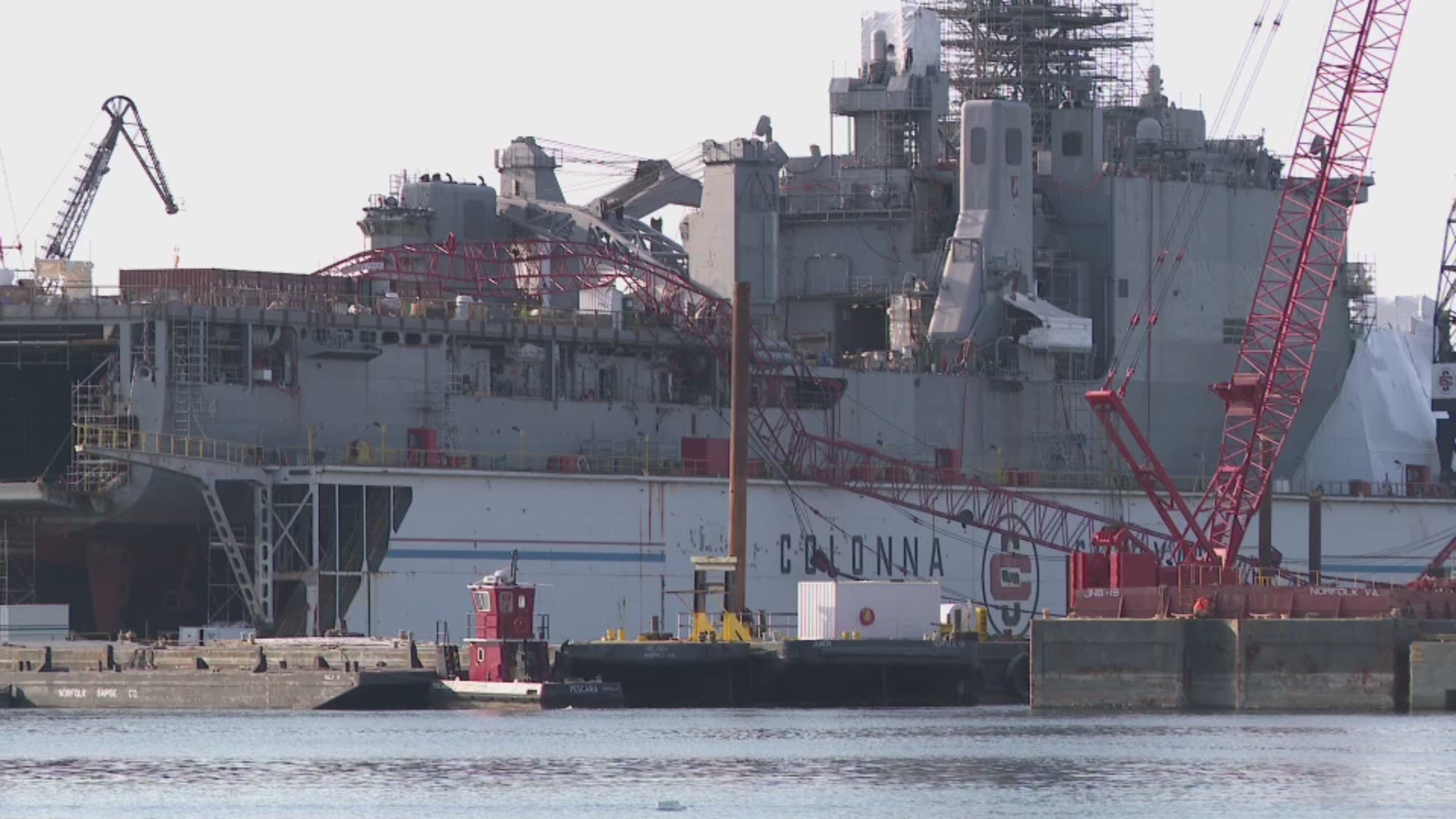 Two sailors were injured when a Colonna's Shipyard crane boom fell onto the USS Gunston Hall, Navy officials said.