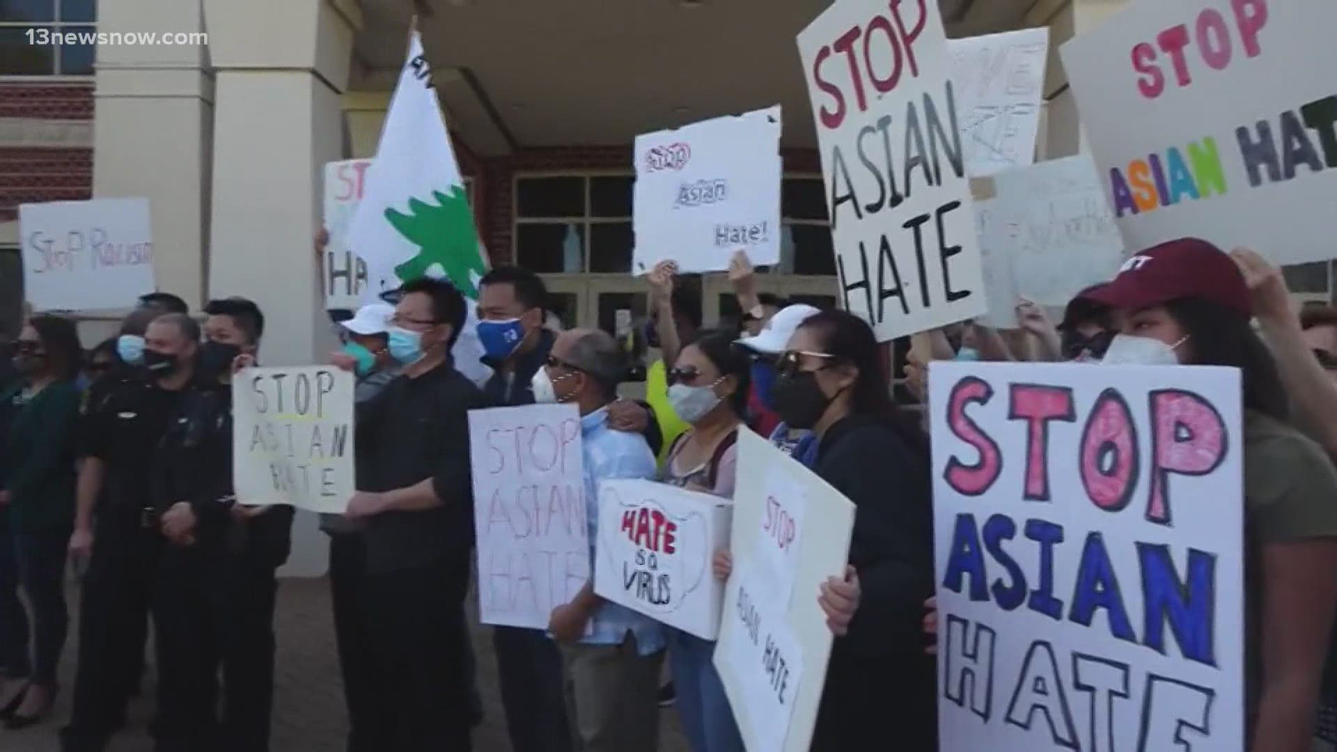 Outside police headquarters, dozens of people chanted, "stop Asian hate!"