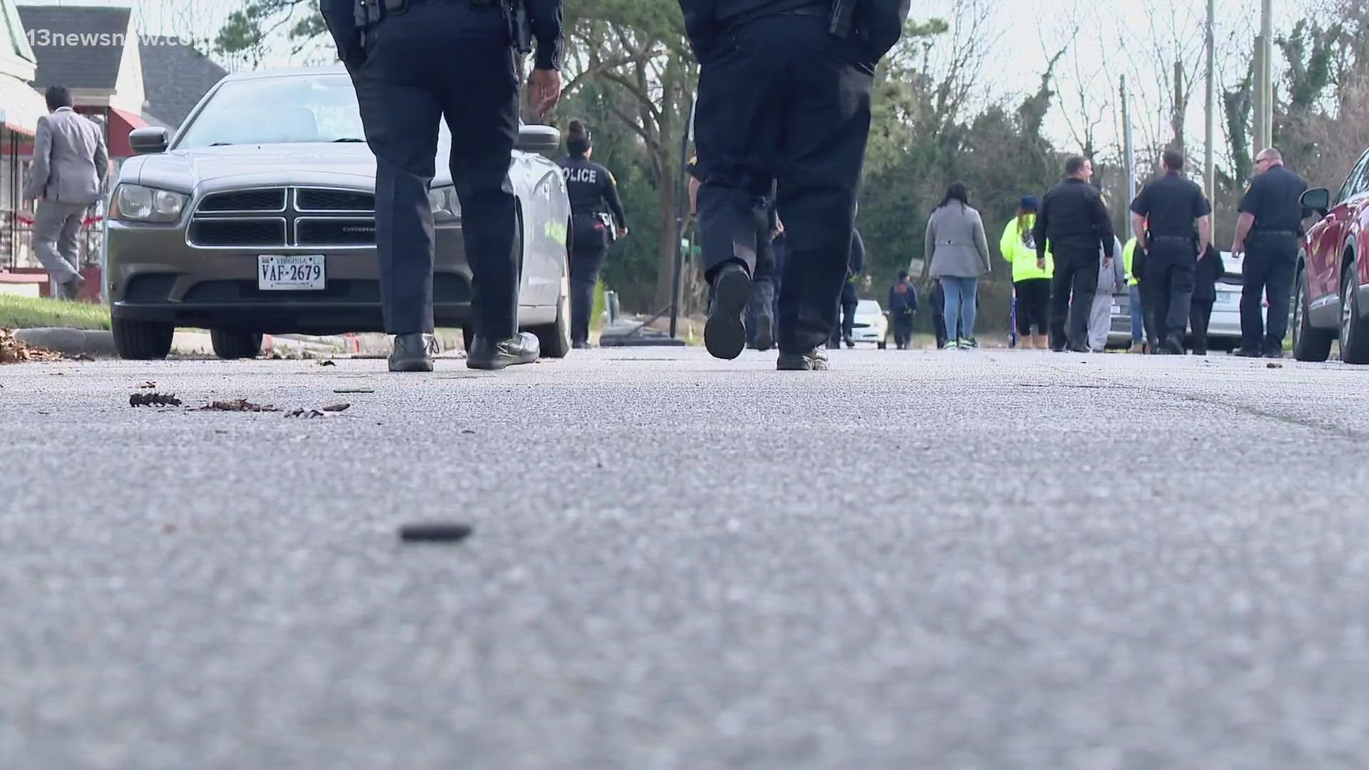 Officers and community activists hit the pavement for a reset walk in Prentis Park. That's where police say someone shot and killed a set of twin brothers.
