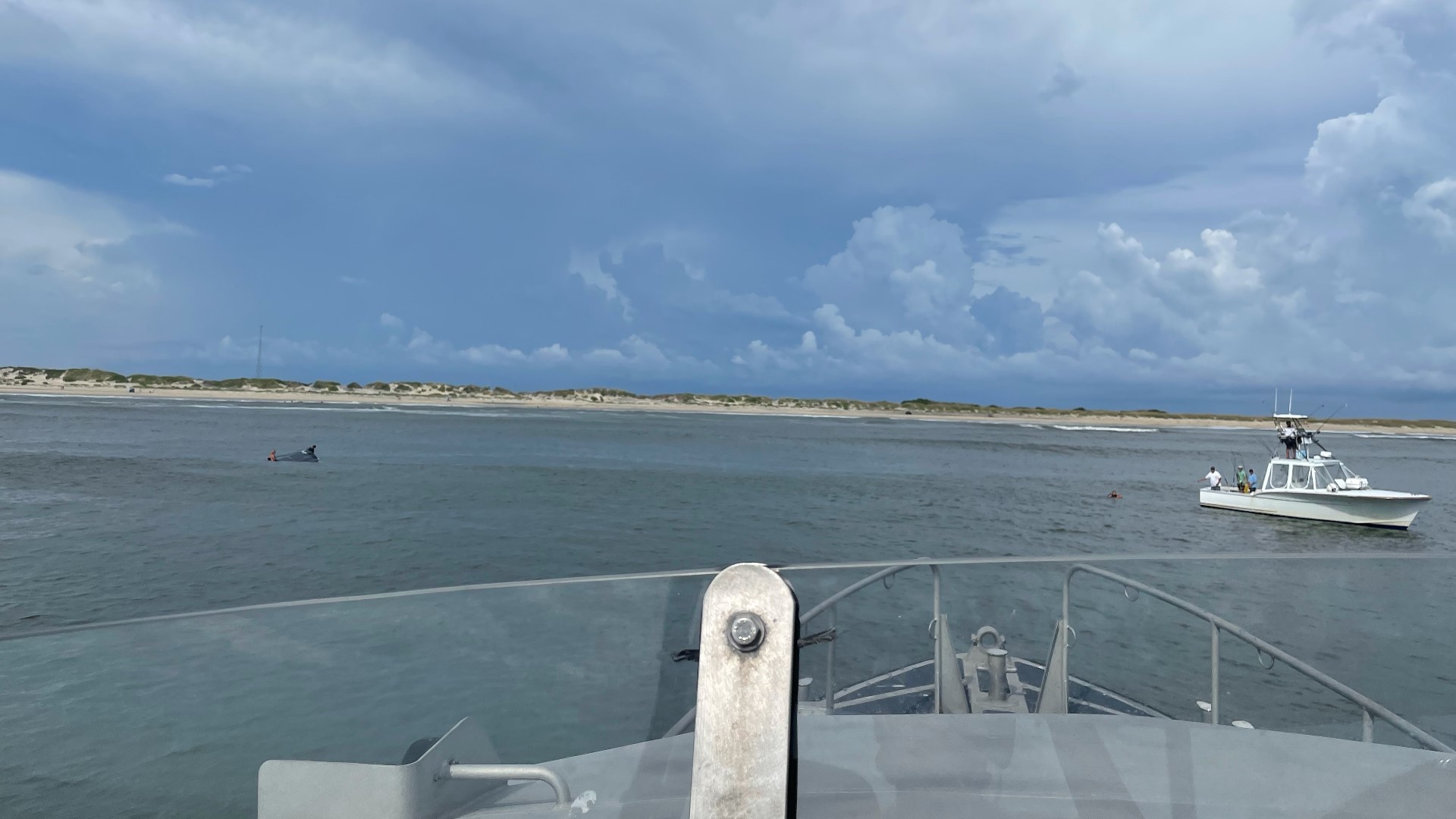 PHOTOS 3 rescued from Oregon Inlet after boat capsizes