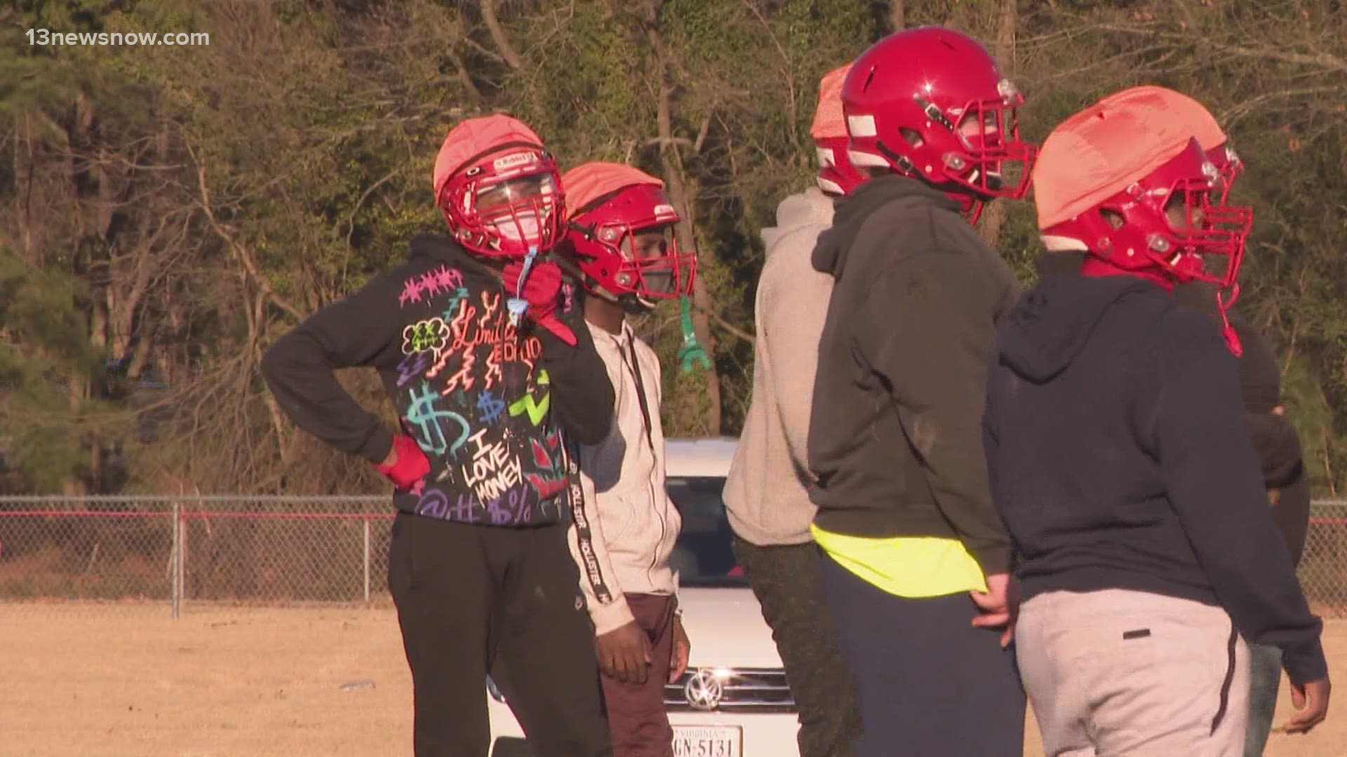 High school athletes in Norfolk Public Schools have traded heat and humidity for cold weather on the first day of football practice.