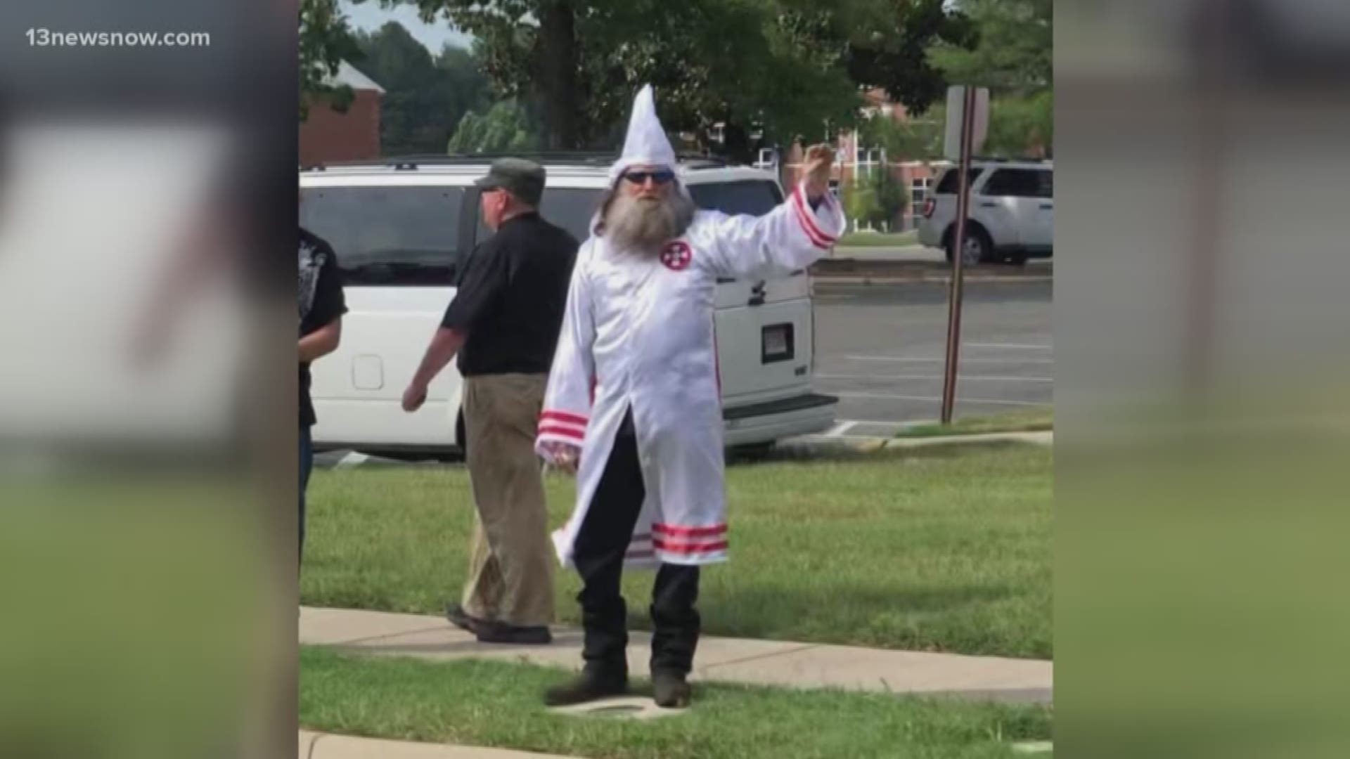 About a dozen people wearing white Klan robes and waving Confederate flags held a recruitment rally Saturday outside a Virginia courthouse.
