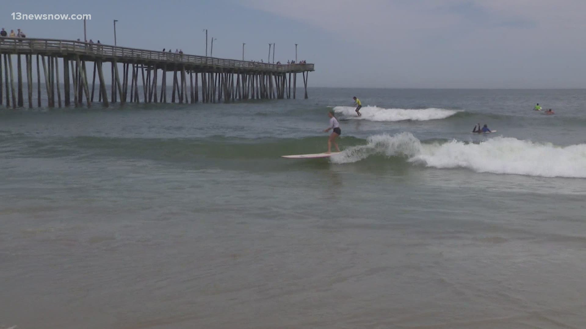 For the past 36 years, surfers were banned from hitting the water at the pier. Photojournalist Rick Dillow takes us inside the event.