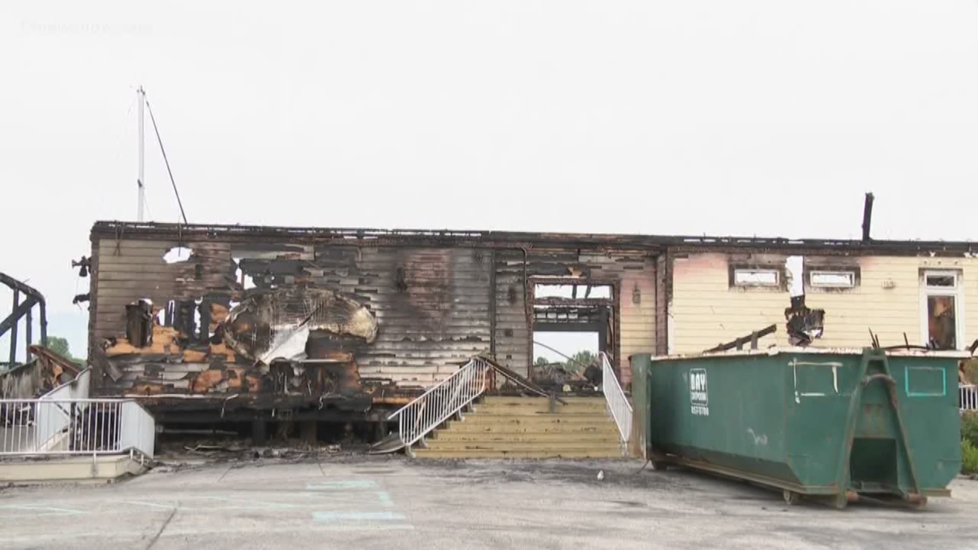 Flames tore through the restaurant Wednesday morning destroying the restaurant and damaging nearby boats.