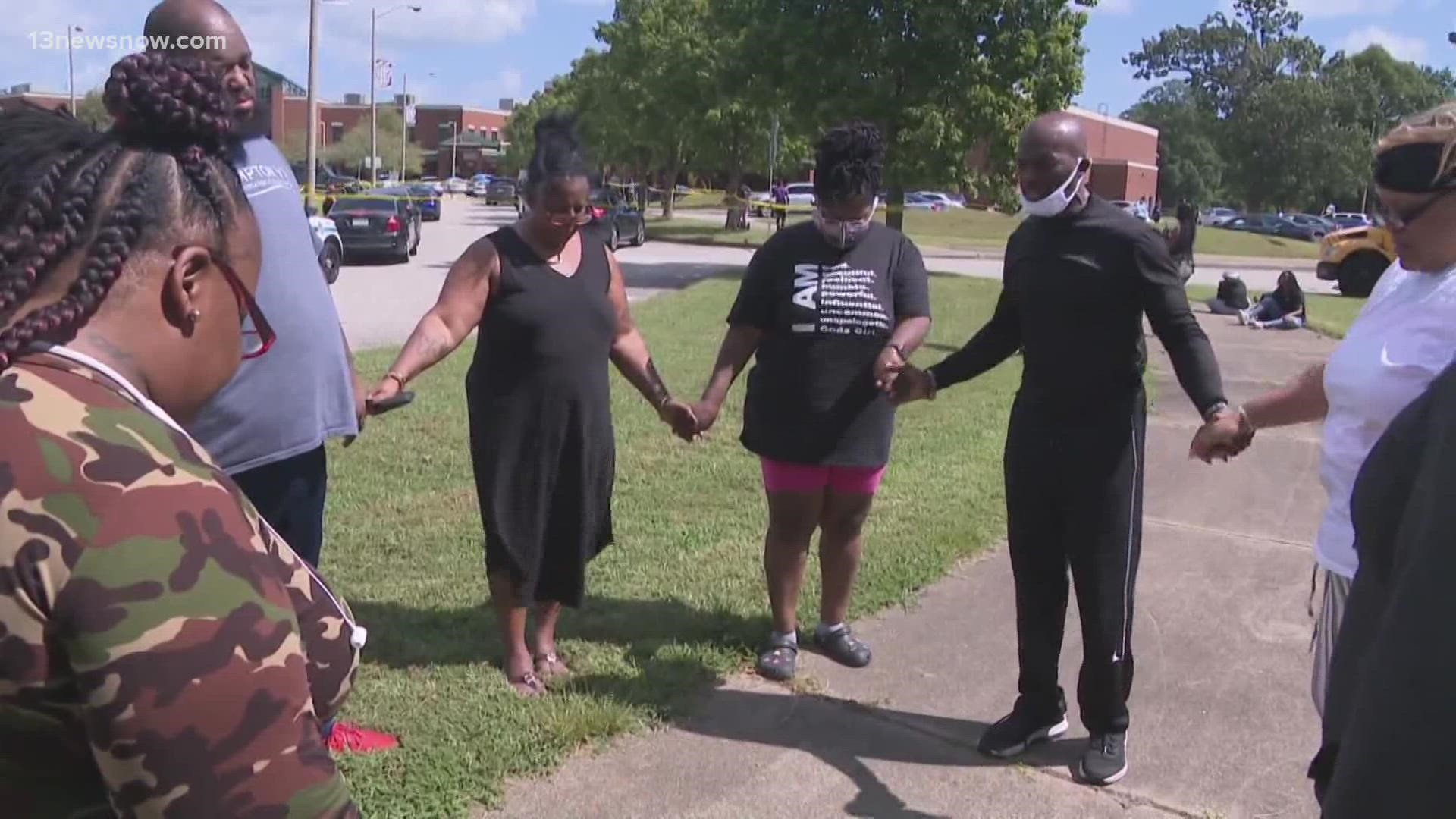 Parents and loved ones swarmed the school grounds, panicked as they rushed to find their kids after two 17-year-olds were shot on Monday morning.