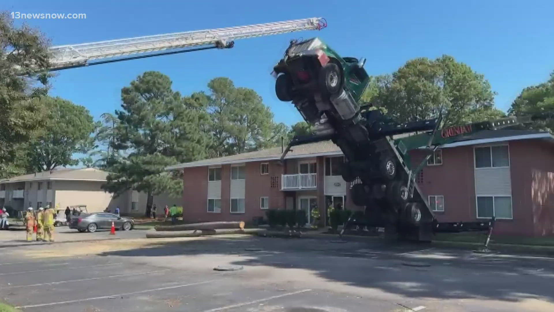 Crane boom tips over onto Virginia Beach apartment | 13newsnow.com