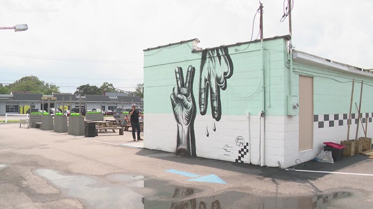 Artist paints 'Peace Virginia' mural in Virginia Beach's ViBe District