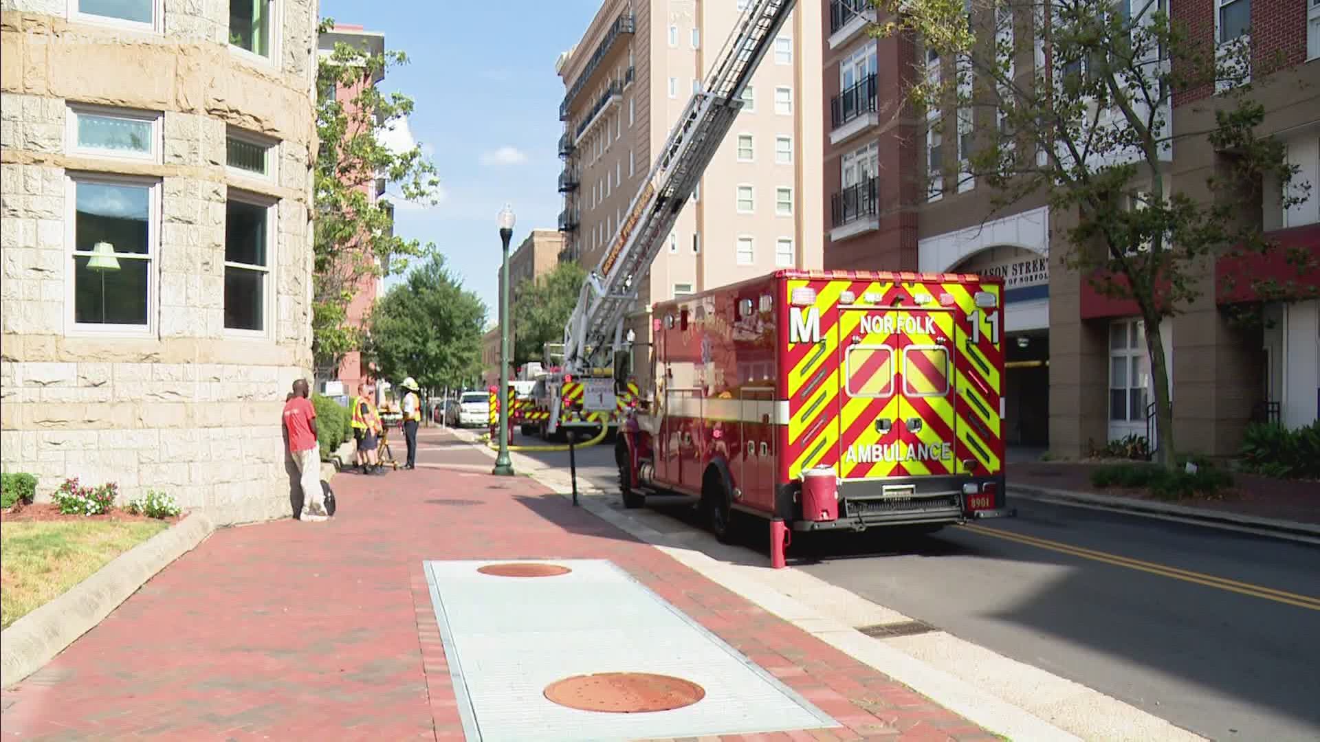 Firefighters battled flames that broke out right on top of a condominium building on Boush Street in downtown Norfolk.