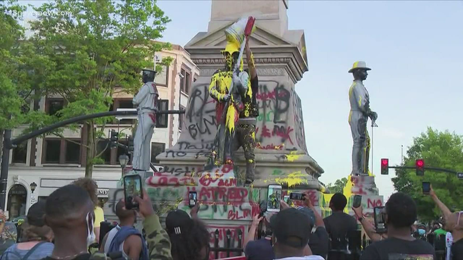 One person was injured as protesters spray painted and tore down parts of Portsmouth's Confederate monument on Wednesday night.