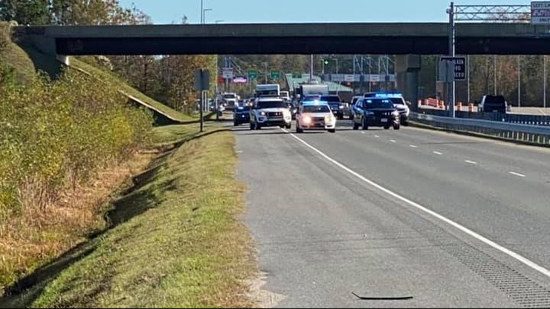 Currituck County sheriff's deputies said a man with a gun robbed someone outside a Food Lion in Grandy, then left in a car stolen from Chesapeake.