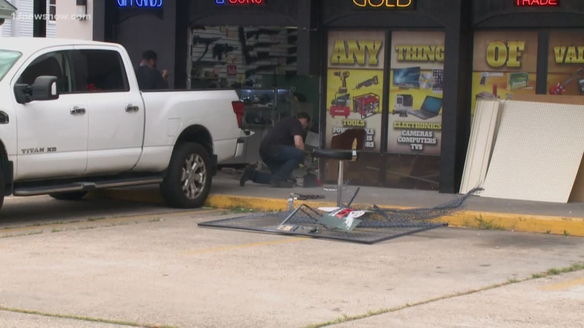 Portsmouth police are investigating after a car crashed into a Pawn Shop.