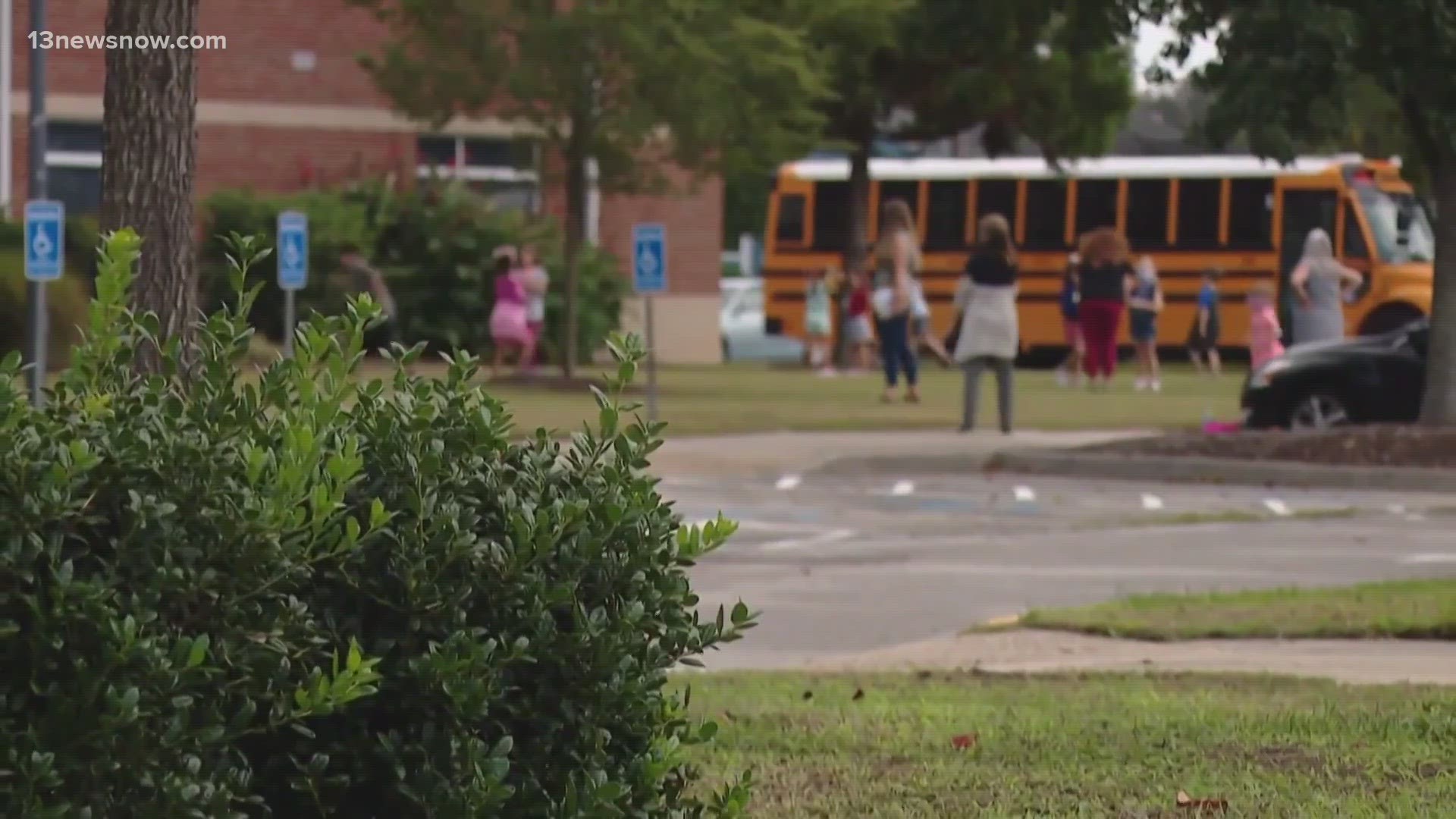 The school board approved letting school-employed security officers carry guns as part of their job.