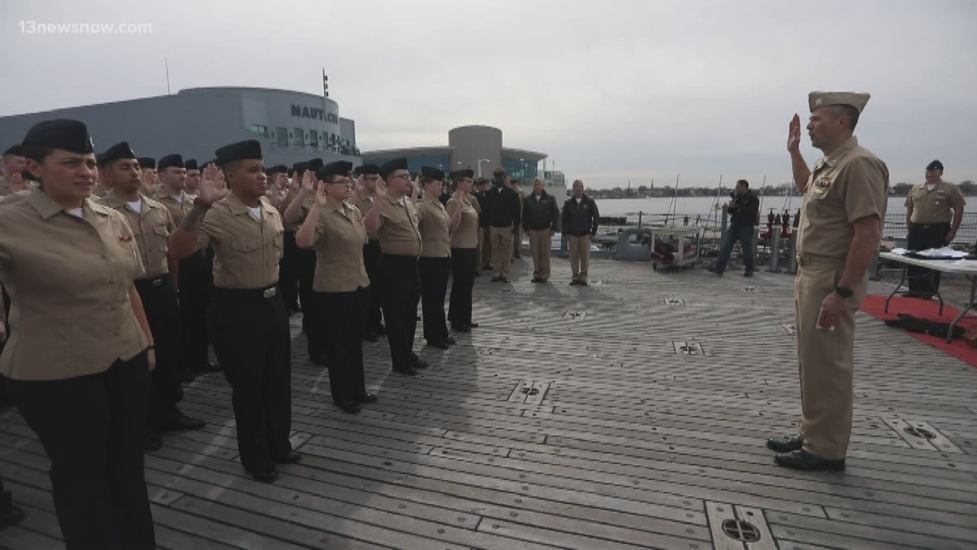 39 sailors reenlisted in the Navy in a ceremony aboard the Battleship Wisconsin at Nauticus in Norfolk.