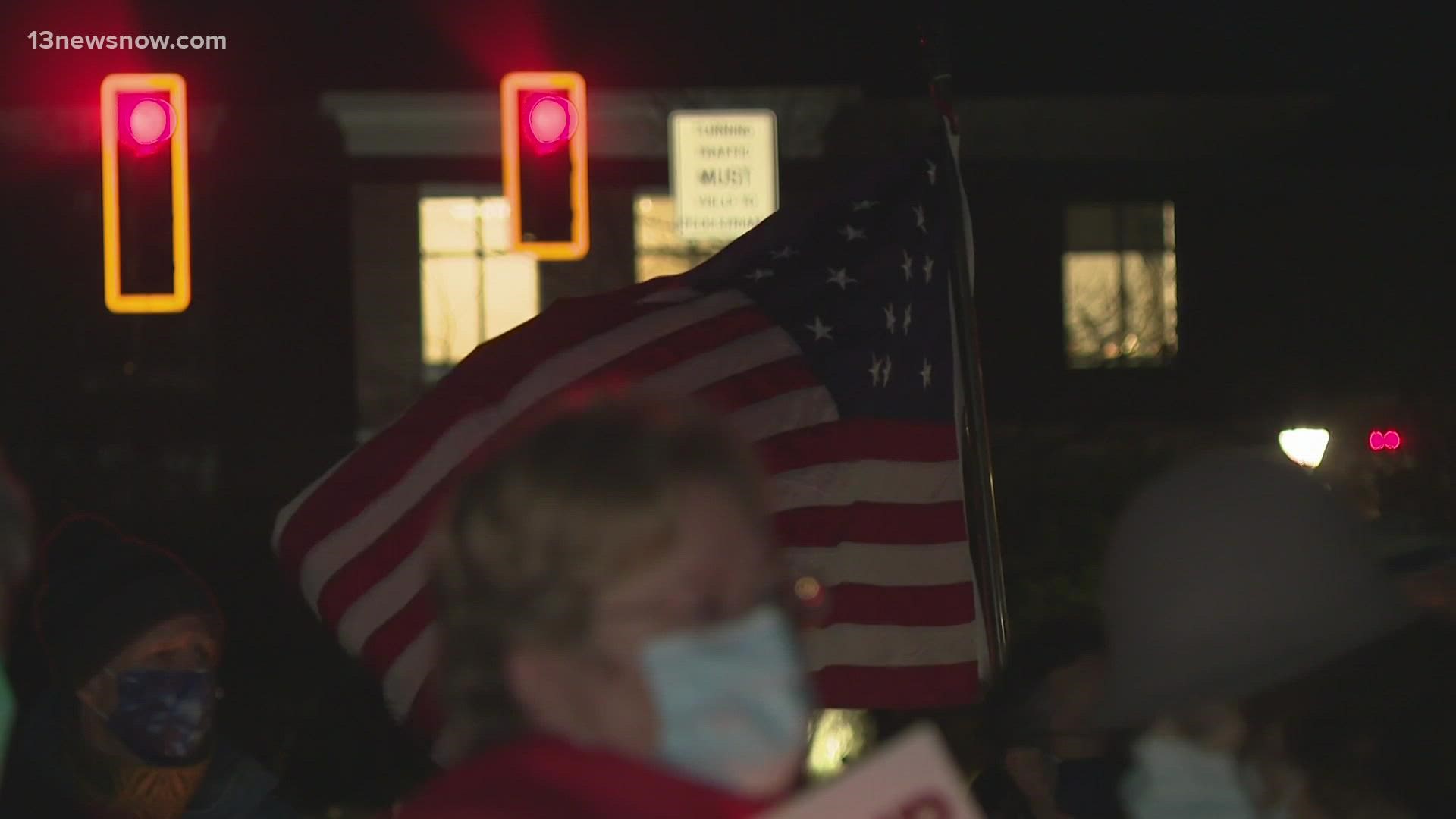 About 50 people showed up to a "vigil for democracy" in Williamsburg one year after a mob stormed the U.S. Capitol.