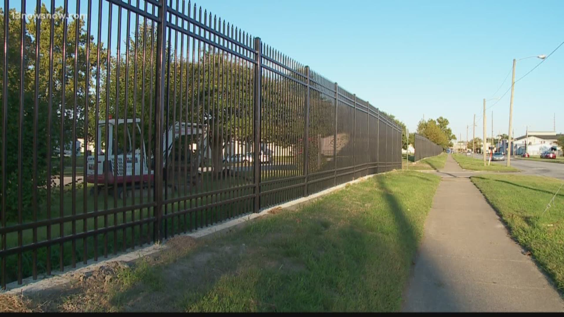 A fence surrounding a low-income apartment complex in Portsmouth has people outraged