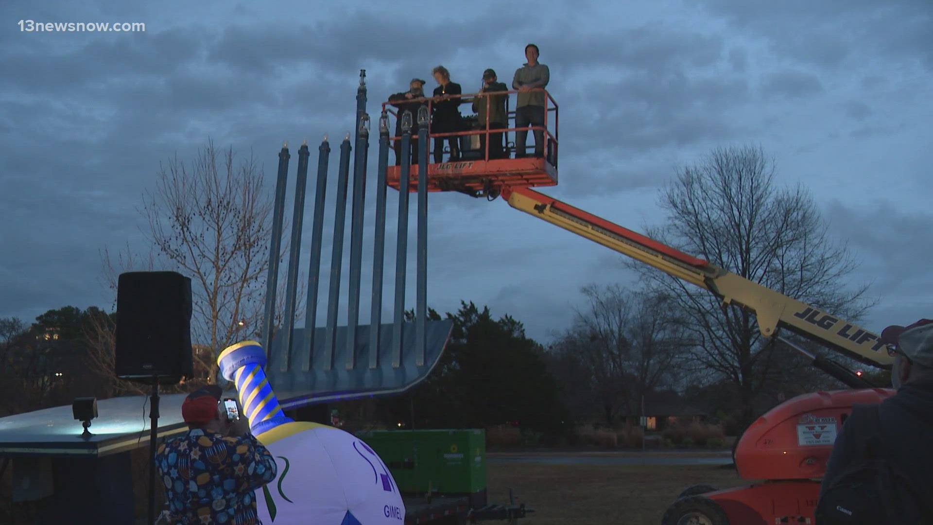 Dozens gathered to watch the lighting of a 30-foot-tall menorah, as part of the 42nd annual "Community Hanukkah Extravaganza."