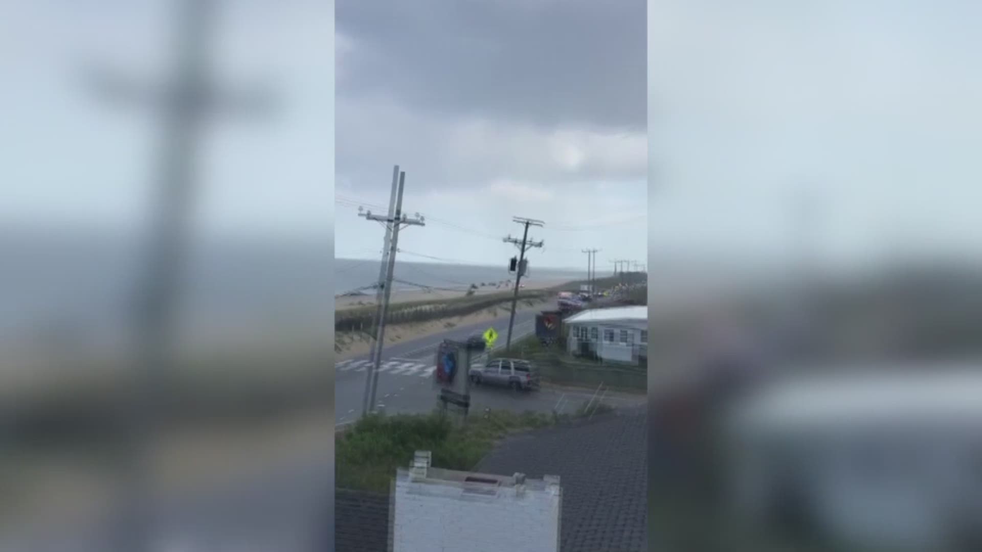 Cell phone video caught the moments first responders were at the beach after a 23-year-old man was hit by lightning while swimming. There is no word on his condition.