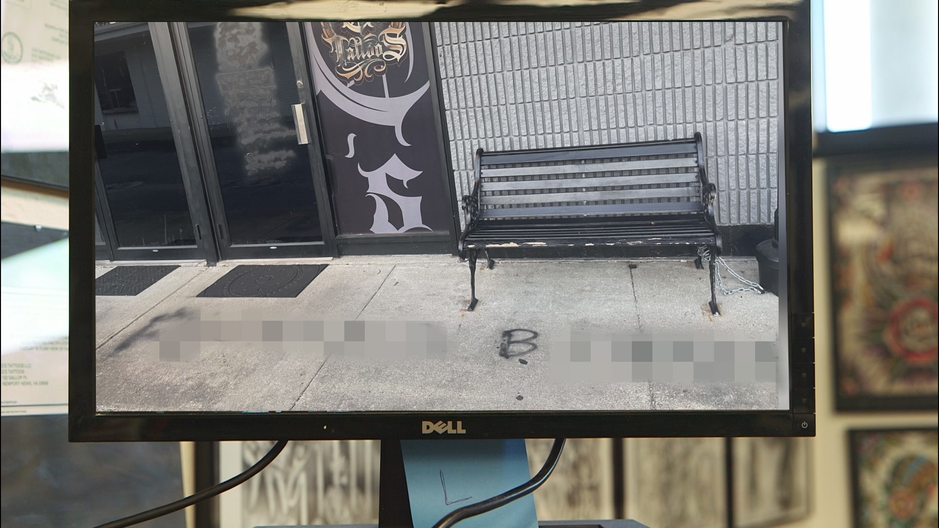 Masked vandals spray paint Newport News tattoo shop