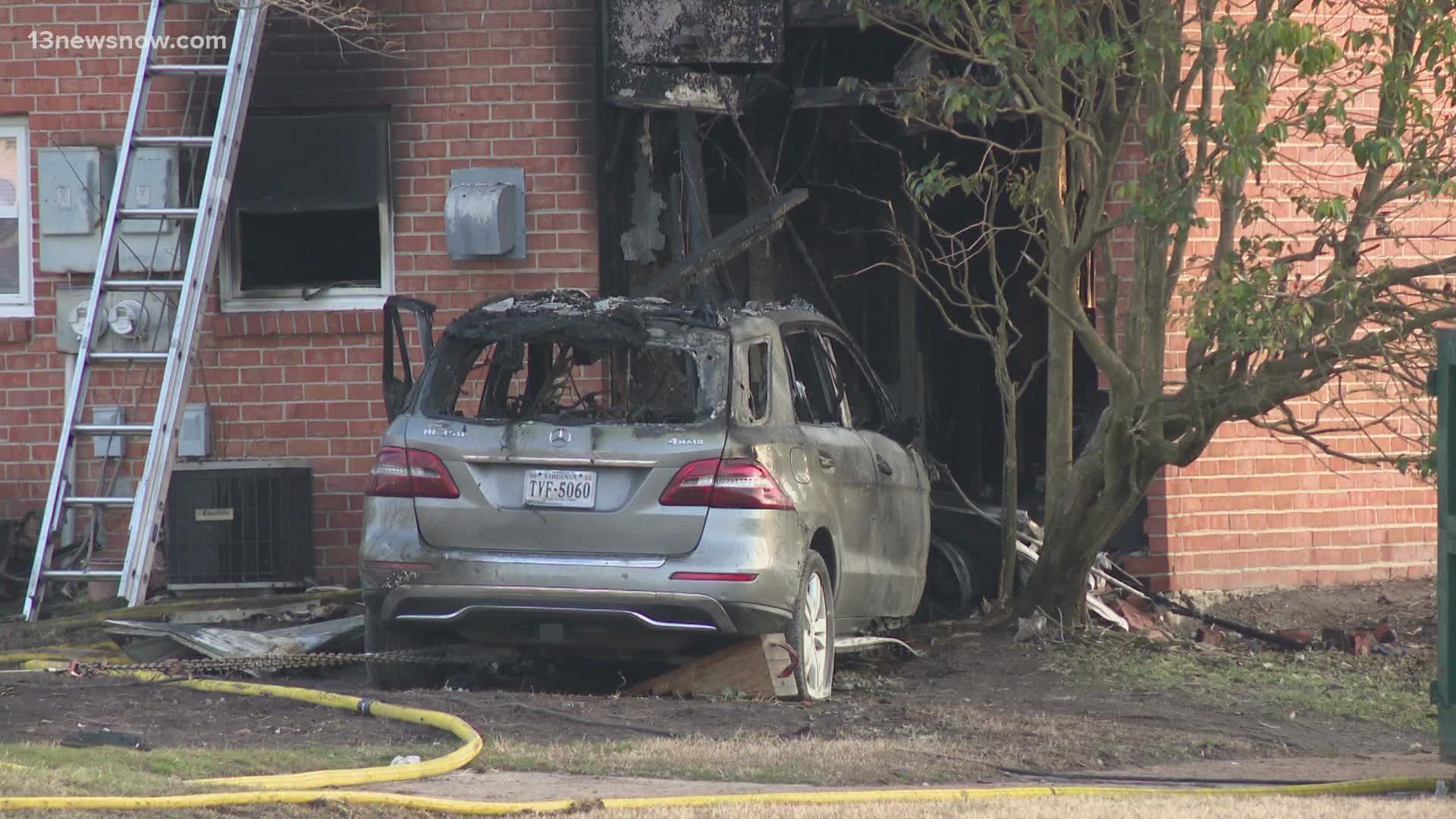 Police and firefighters responded to a townhouse in Virginia Beach after a car crashed into the building, causing it to catch fire.