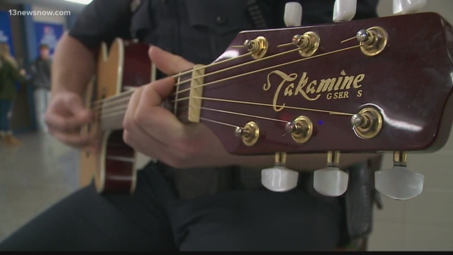 Guitar-playing SRO's hobby becomes his trademark as he keeps students safe and in check.