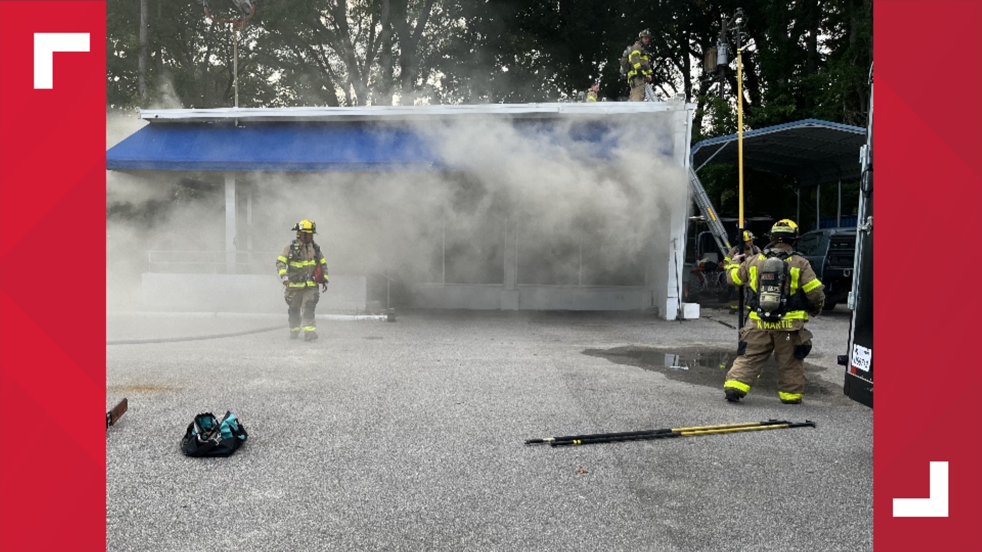 Crews arrived at TrailersPlus to find heavy smoke pouring out of the business but couldn't enter the building right away because of a downed power line.