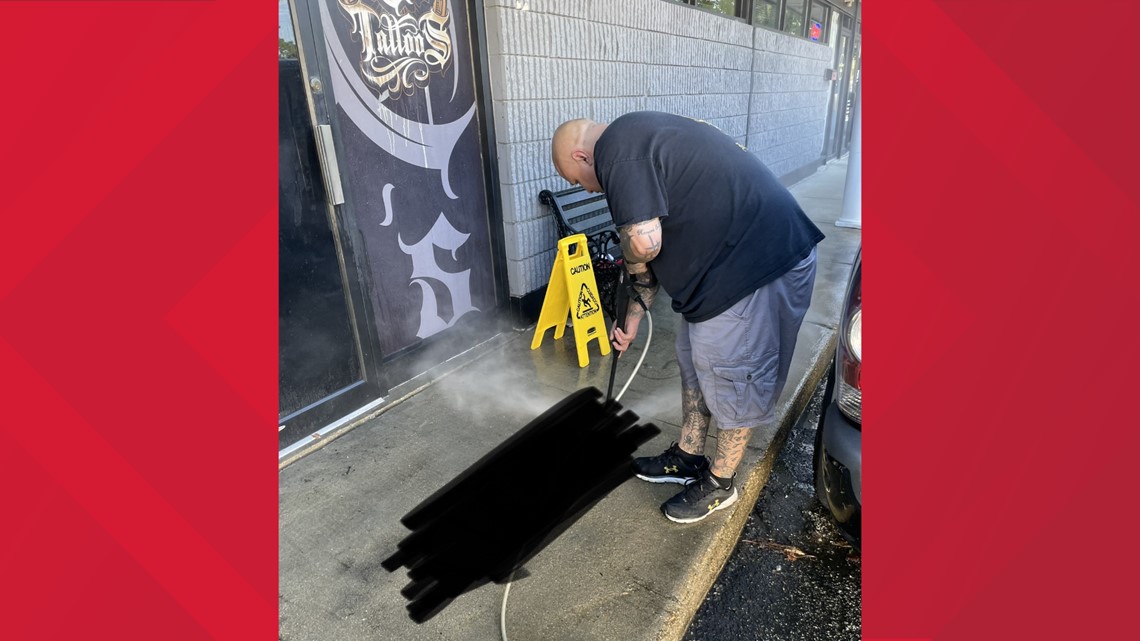 Masked vandals spray paint Newport News tattoo shop