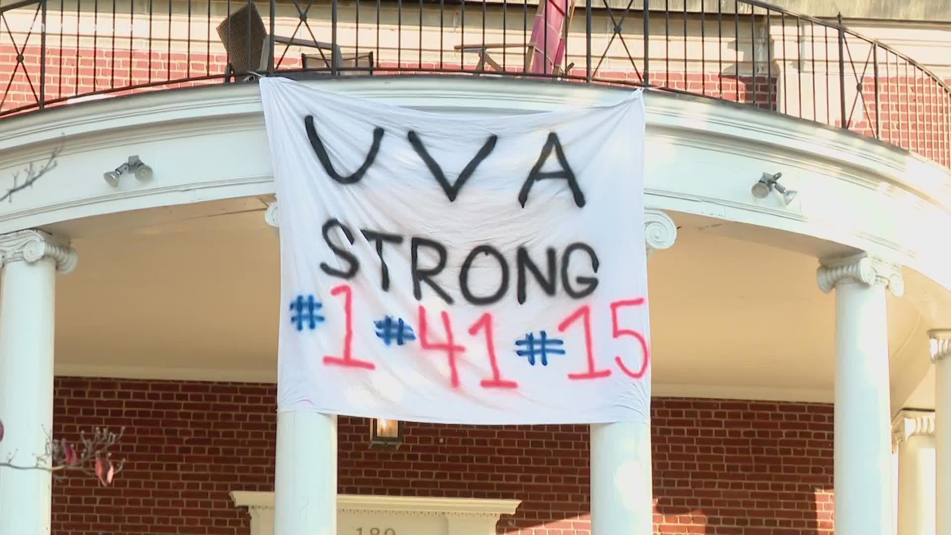 Hundreds of students filled the South Lawn at the University of Virginia to honor the three football players who were shot and killed Sunday night.