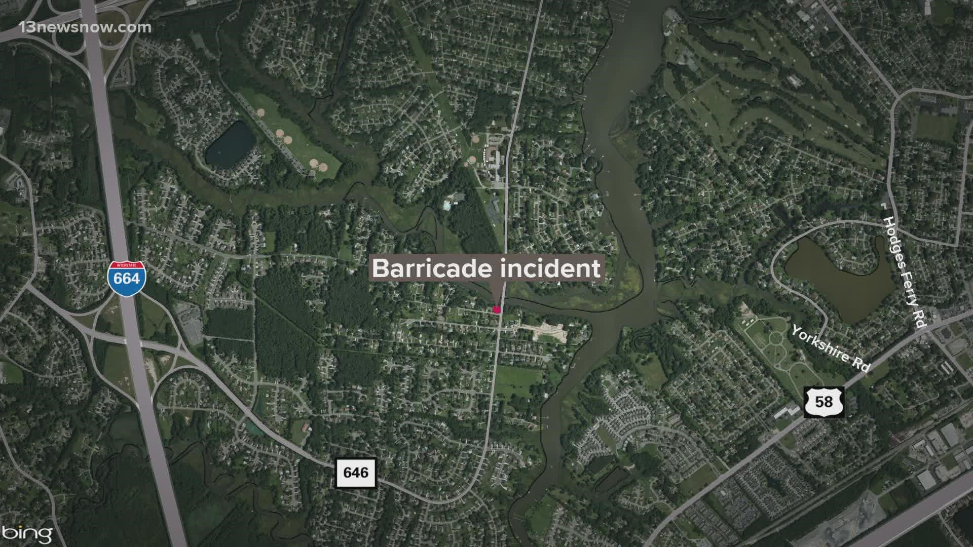 Police say a suspect who barricaded himself inside a Chesapeake home and at one point fired at an armored vehicle is now in custody, and that no one was hurt.