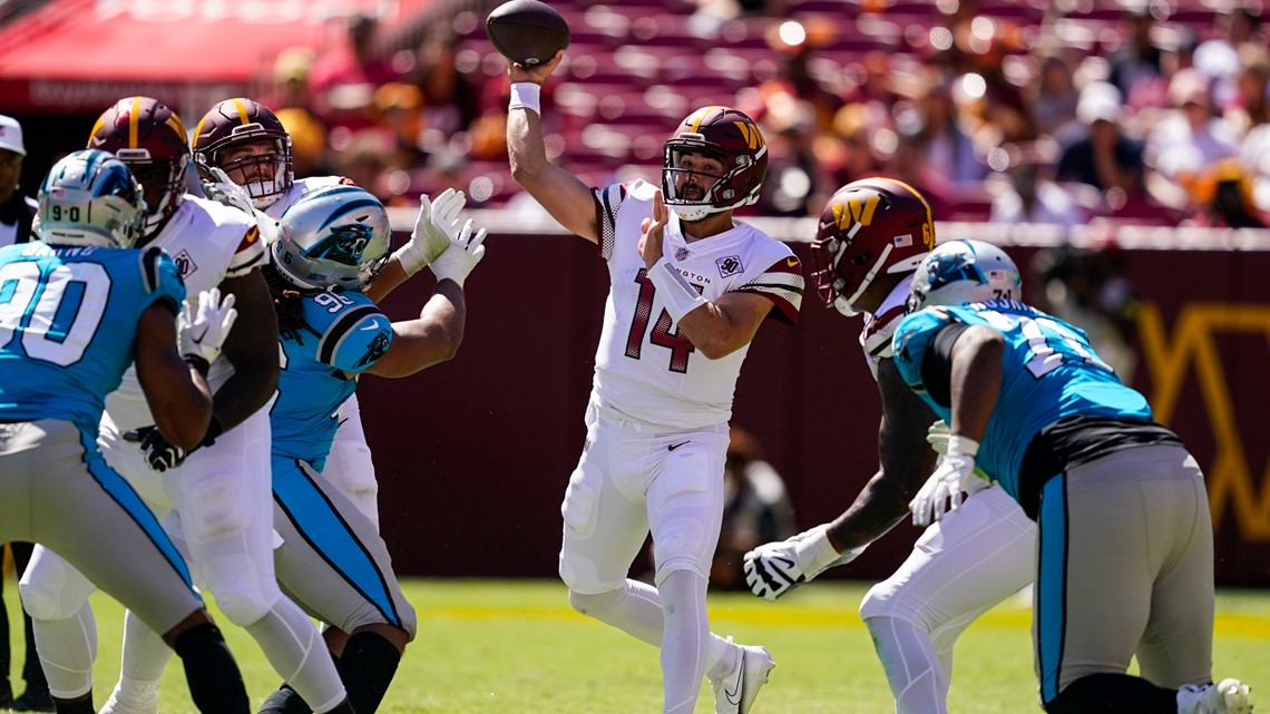 Washington Commanders quarterback Carson Wentz (11) in action during the  first half of a preseason NFL football game against the Carolina Panthers,  Saturday, Aug. 13, 2022, in Landover, Md. (AP Photo/Nick Wass