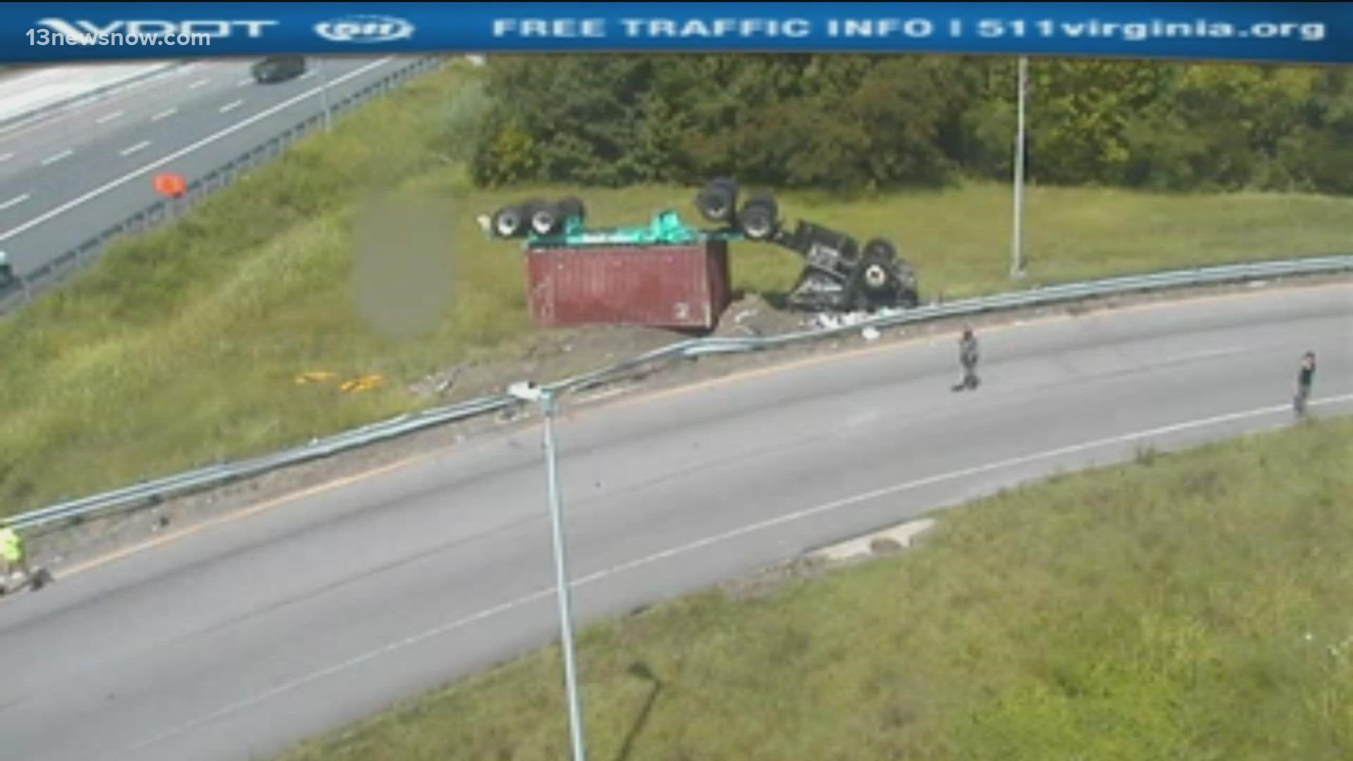 Officials say a driver of a tractor-trailer flipped over while on the exit ramp of Interstate 564. Emergency crews worked to clear the debris.