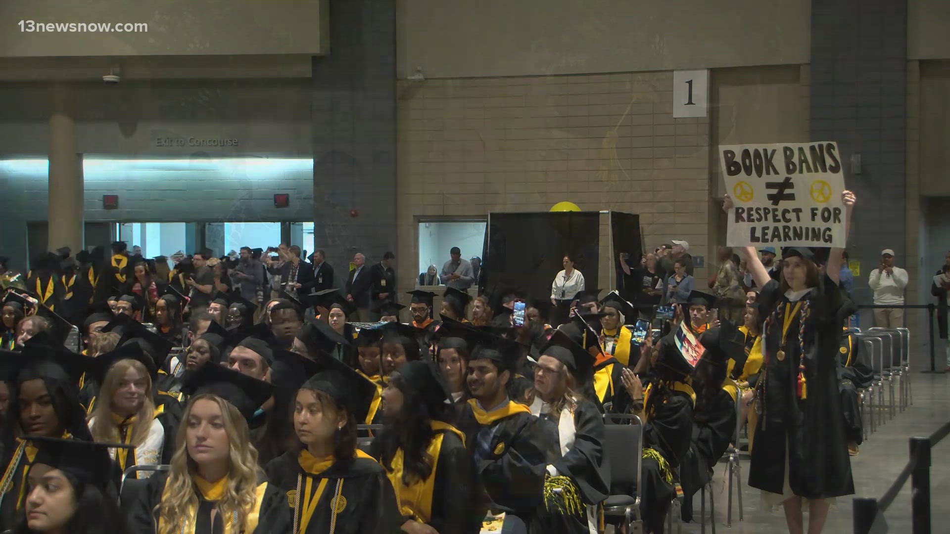 Dozens of students walk out of Gruadtion at Virginia Commonwealth University after the ceremony's keynote speaker Gov. Glenn Youngkin was introduced.