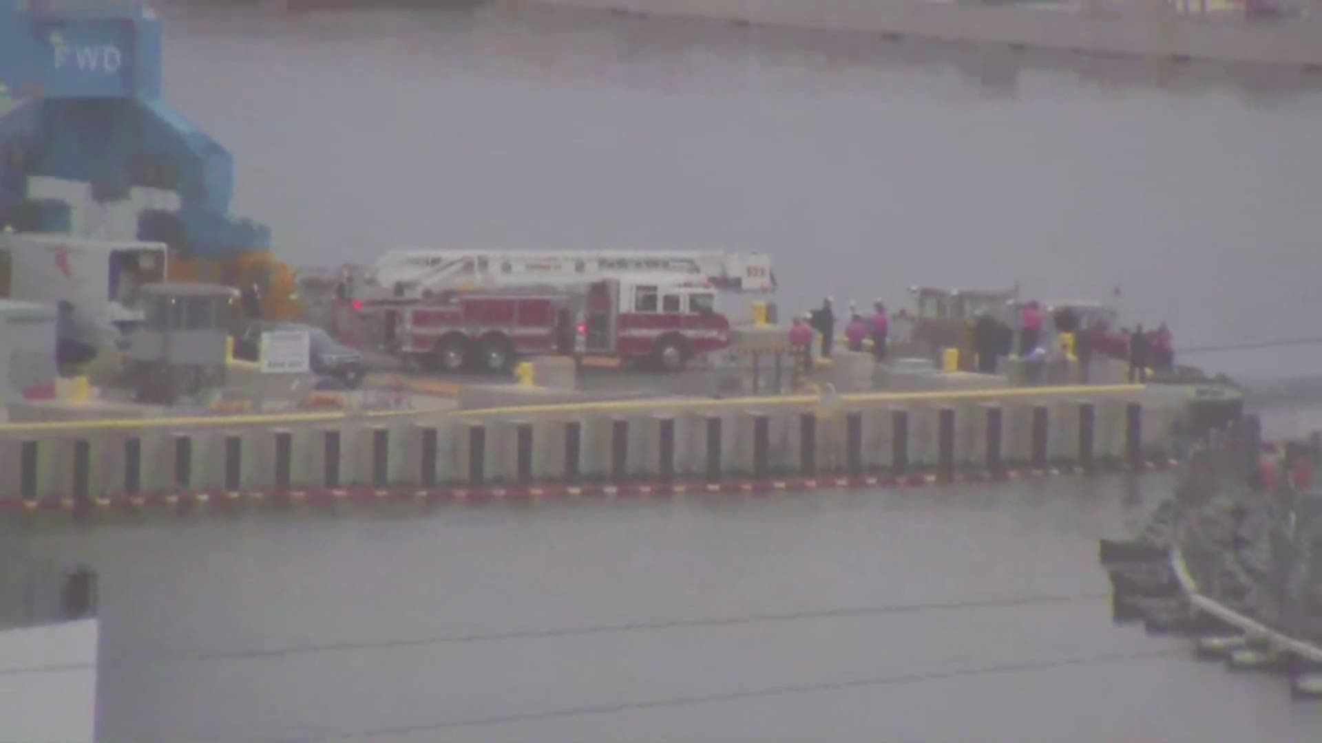 Crews worked to recover a body found near Pier 5 at Norfolk Naval Shipyard.