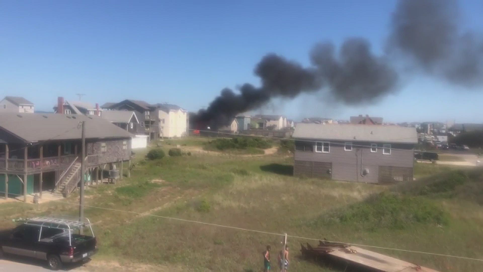 A fire broke out at a Kitty Hawk beach home near the 3.5 mile post on Monday afternoon. Videos courtesy Janet Monahan and Susan Stickles.