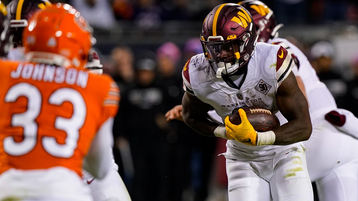 Chicago Bears quarterback Justin Fields runs against the Washington  Commanders in the second half of an NFL football game in Chicago, Thursday,  Oct. 13, 2022. The Commanders defeated the Bears 12-7. (AP