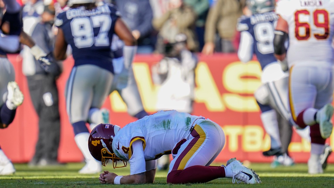 Washington Football Team quarterback Taylor Heinicke (4) dives