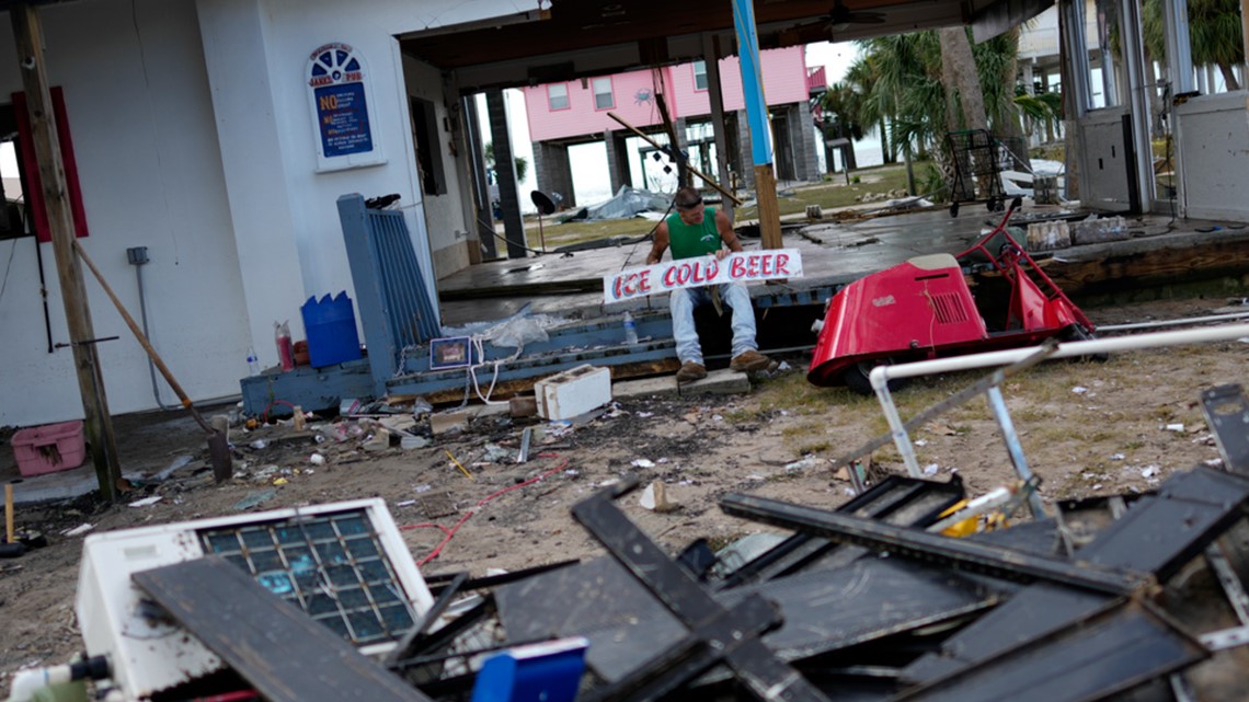 Residents pick through the rubble of lost homes and scattered belongings in  Hurricane Idalia's wake