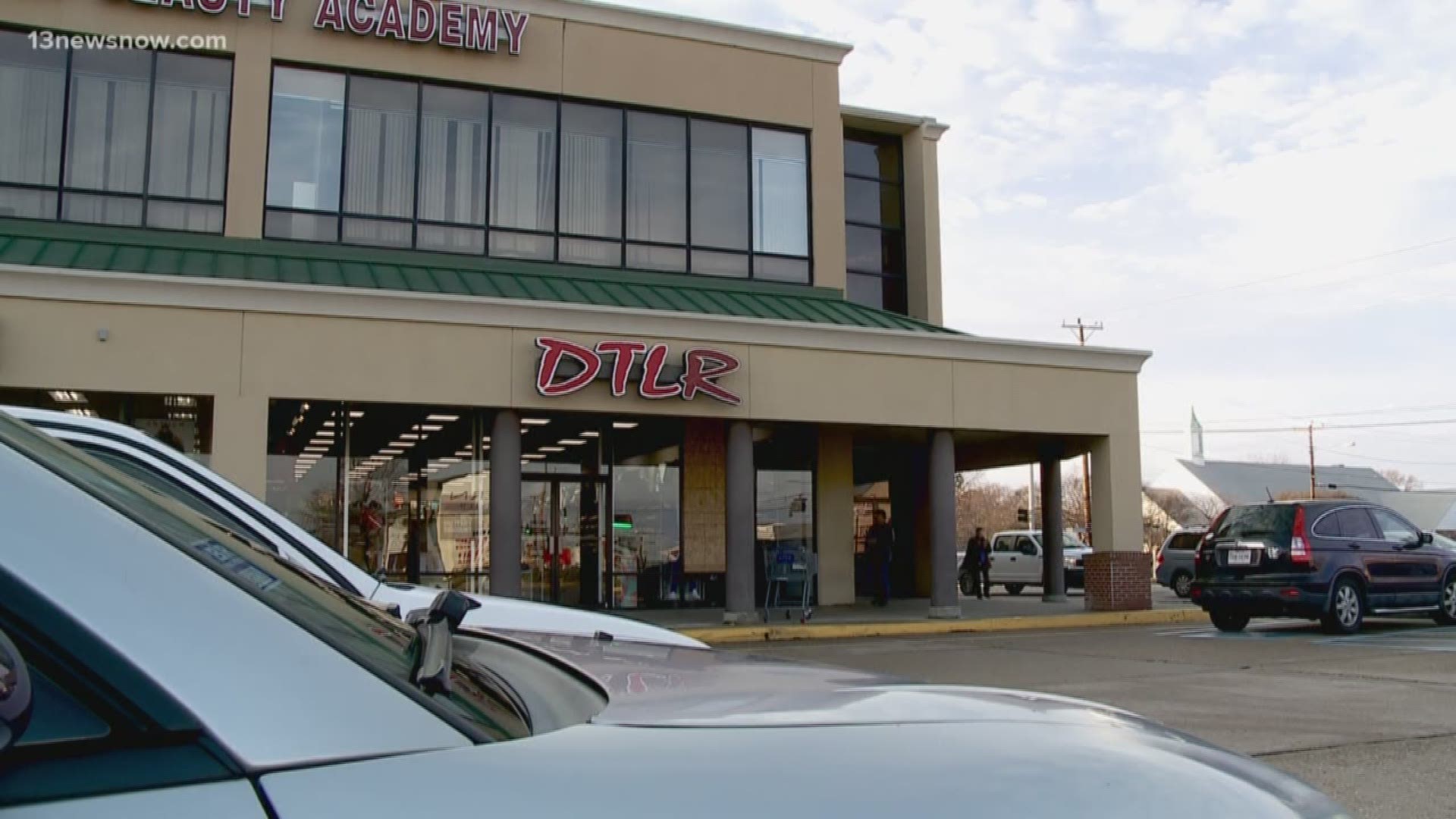A parking lot shooting sent stray bullets through the window of DTLR, shattering the window.