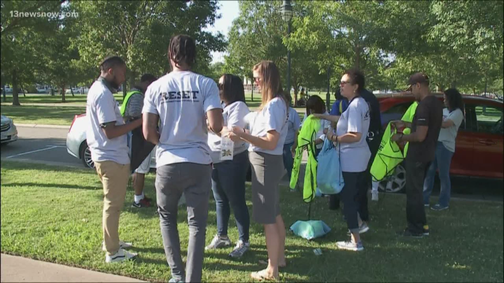 Volunteers held a RESET walk in Buckroe Beach after a shooting that injured four people, including four kids, remains unsolved.