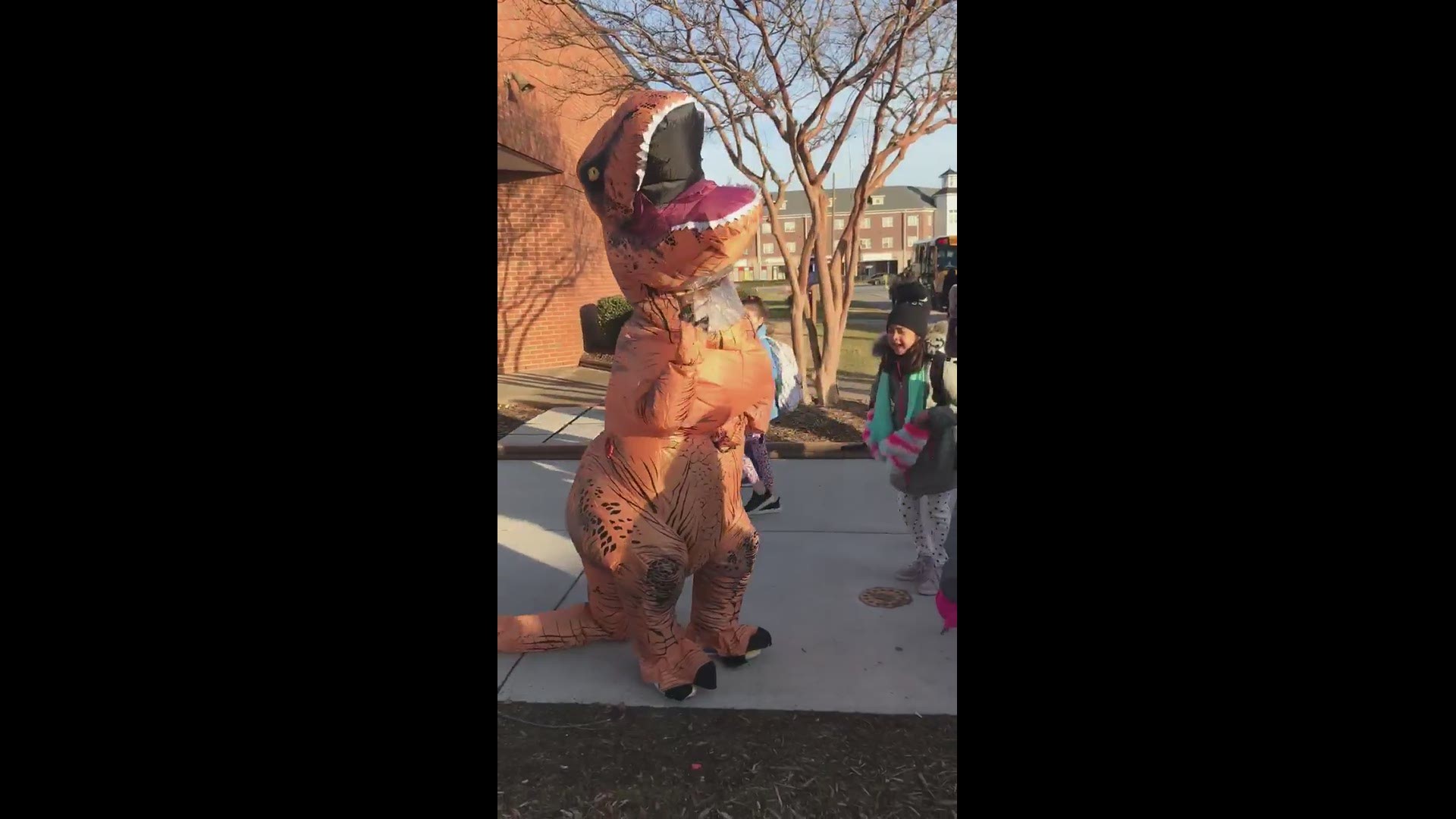 Centerville Elementary School parent Meg Glomski shared video of a T-Rex greeting children outside the school in Virginia Beach. The PTA's book fair has a dinosaur theme, and the group thought the T-Rex was a great way to get students excited about reading!