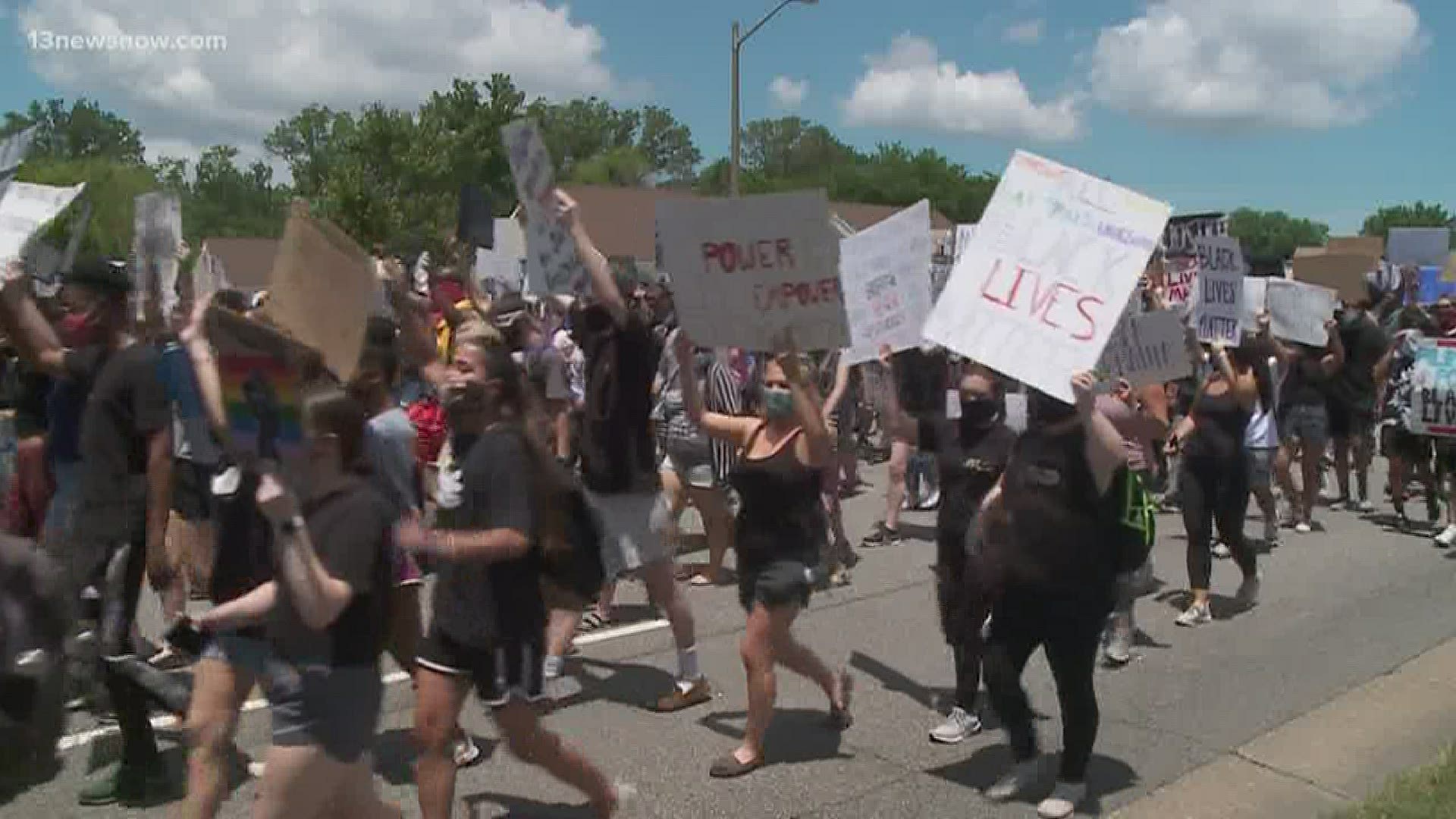 Hundreds of protesters marched together, chanting "Black Lives Matter."