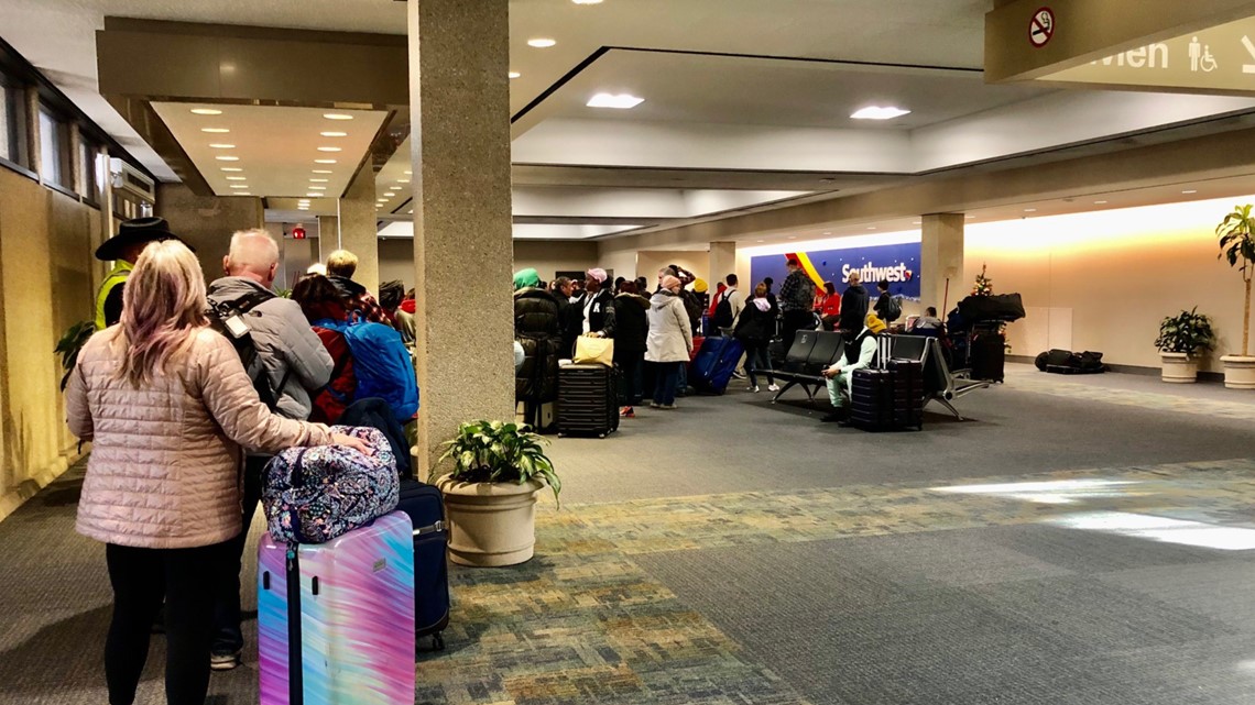 Dozens of travelers wait in airport terminals as bad weather delays flights