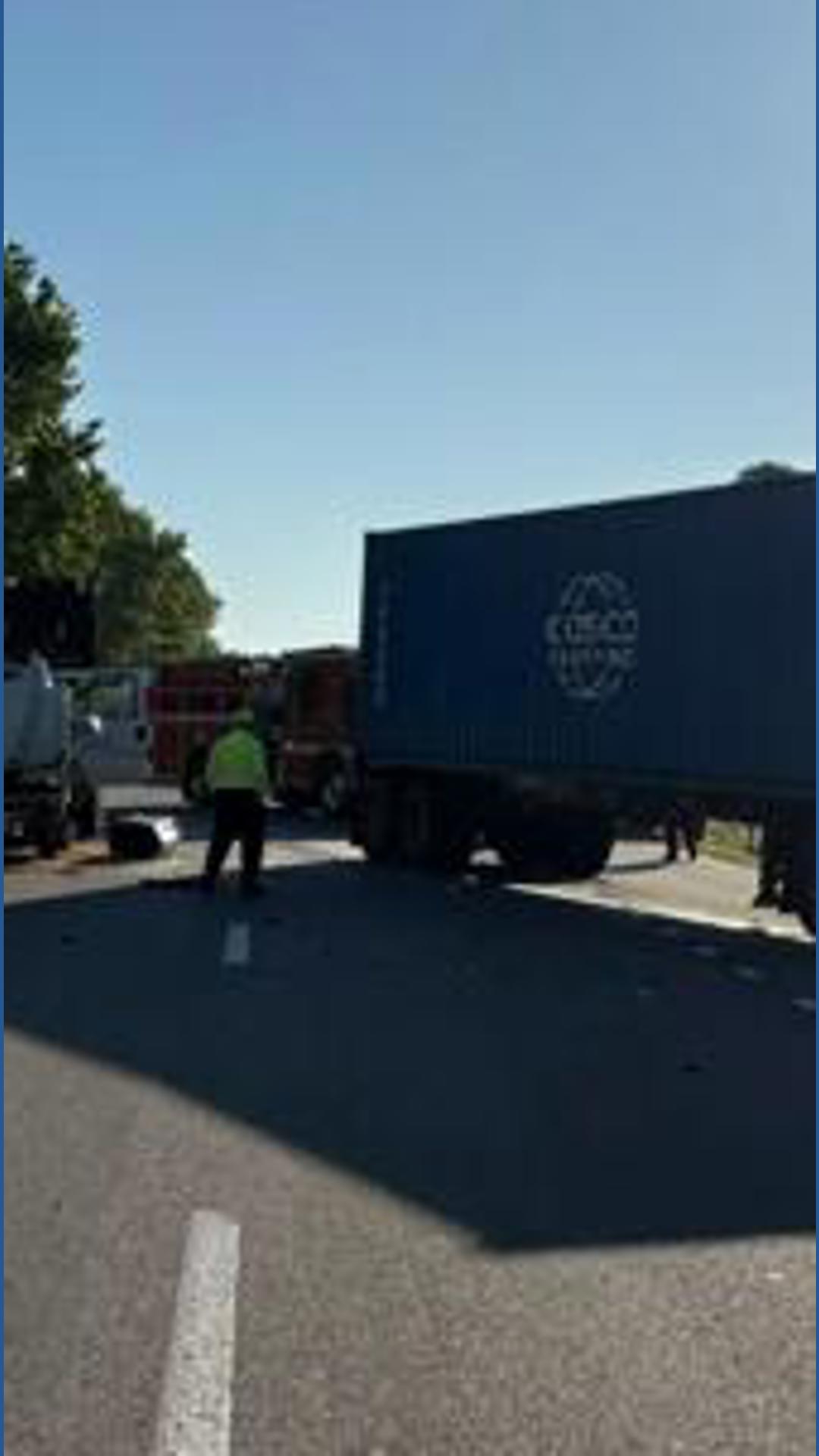 Tractor-trailer crash causes fuel spill, lane closures on South Quay ...