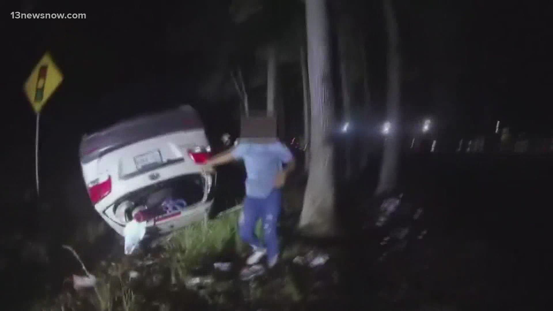A Gloucester county sheriff's deputy saved a mother pinned underneath her car after an accident. Body camera footage shows the deputy in action.