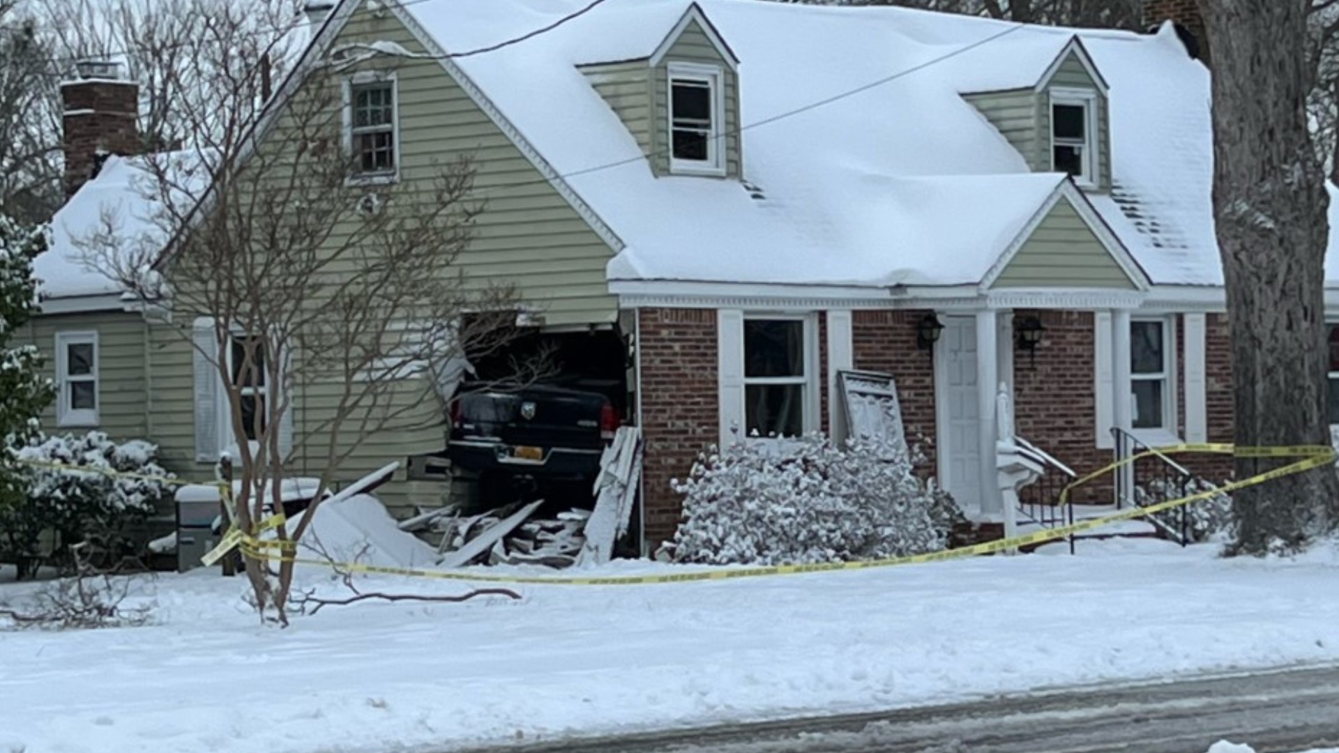 Car crashes into Norfolk home during snowfall