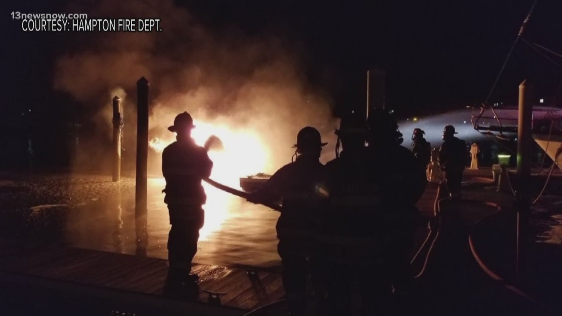 A boat docked at a Hampton marina caught fire early Monday morning and sank to the bottom.