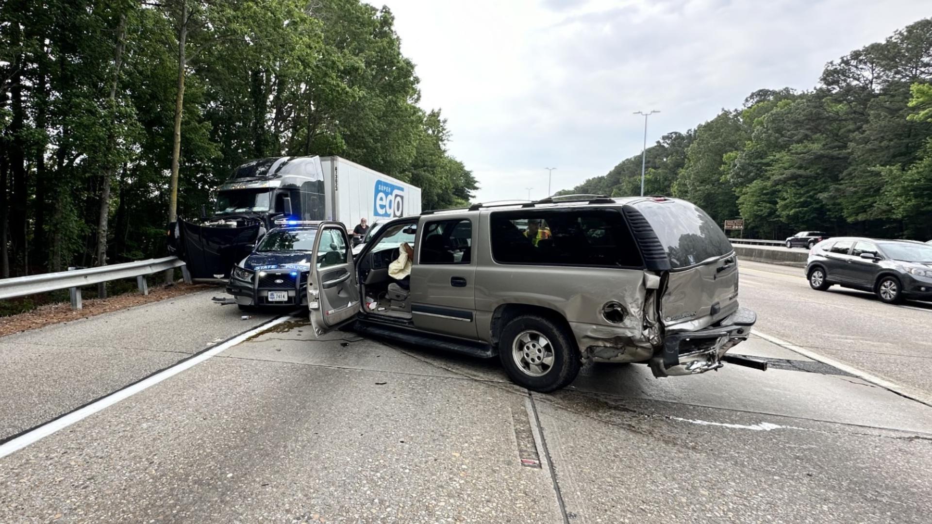 Three civilians and a state trooper were hurt in a four-car crash Friday morning on Interstate 64.