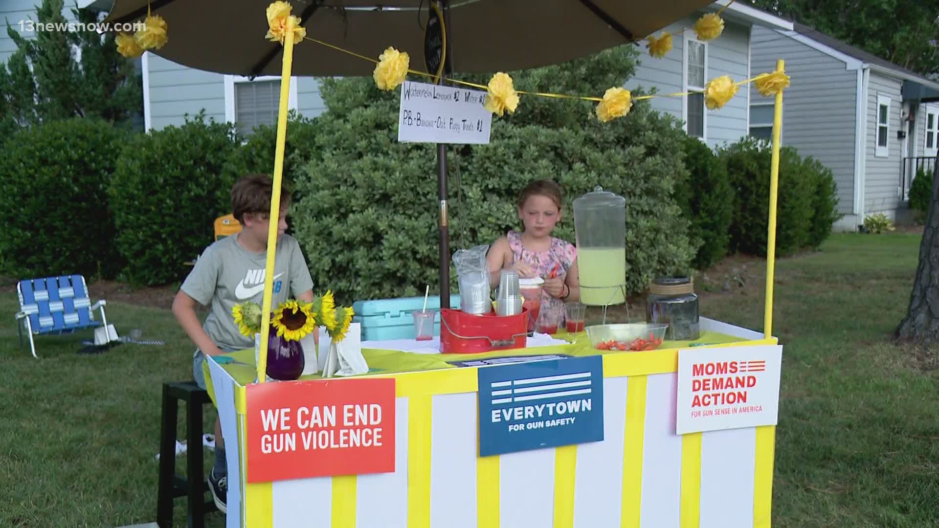 The Johnson family put together a lemonade stand to raise money for "Moms Demand Action."